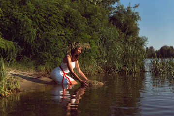 Fototapeta na wymiar Young woman on the banks of the Dnieper river