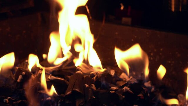 Spicy Chicken Wings Being Grilled Over Bright Glowing Coals of Night Time Broasting On Fire. Night Party Barbecue. Outdoor Cooking. Cook Prepares Oriental Dish In Kitchen. Junk Food, Healthy Lifestyle