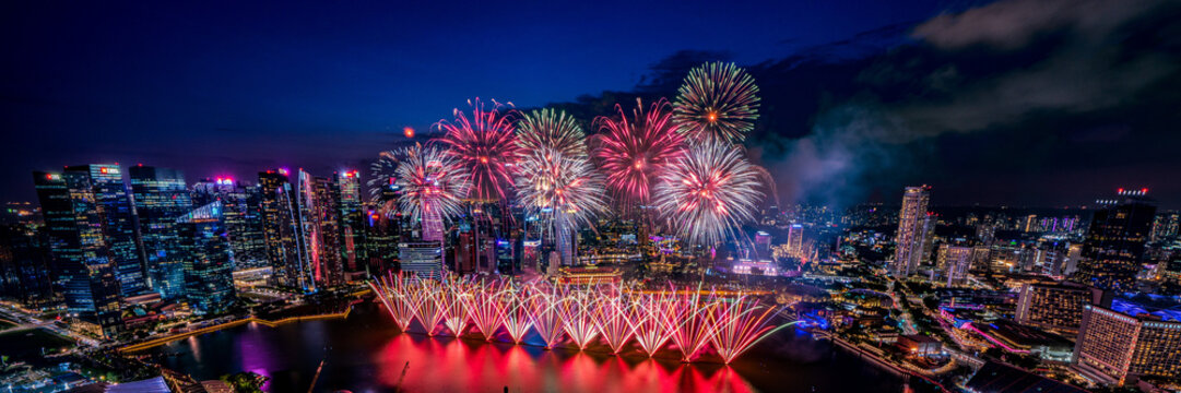 Banner image of fireworks with Singapore city view at night.