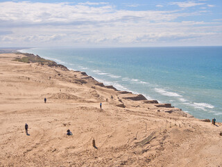 View from old lighthouse "Rubjerg Knude Fyr" with sand dunes and cliffs in Denmark at North Sea