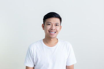 Positive human facial expressions and emotions/The smiles and happy faces of Asian men presenting a white background / advertising model concept
