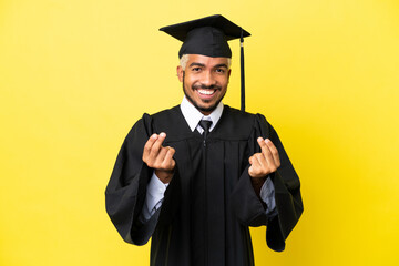 Young university graduate Colombian man isolated on yellow background making money gesture