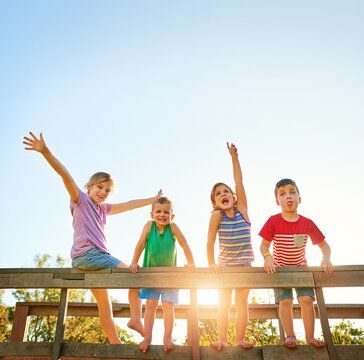 Summers here so lets get the fun started. Portrait of a group of little children playing together outdoors.