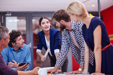 Starting the day with a brainstorming session. Cropped shot of creative professionals brainstorming during a meeting.