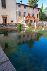 Fototapeta premium Ancient natural hot springs pool in small Italian village Bagno Vignoni in Tuscany