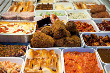 Assortment of gourmet meat dishes in butchery delicatessen shop