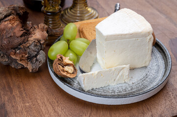 Delice de Bourgogne French cow's milk cheese from Burgundy region of France served with grapes,...