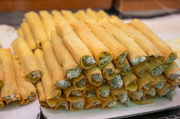 Italian food, fresh home made stuffed pancakes with ricotta cheese and spinach ready to cook, Parma, Emilia Romagna, Italy