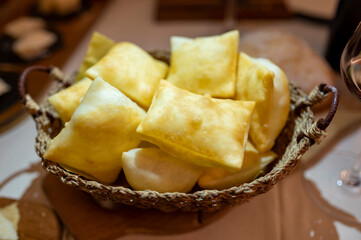 Food of Emilia Romagna region, deep fried bread gnocco fritto or crescentina served in restaurant in Parma, Italy