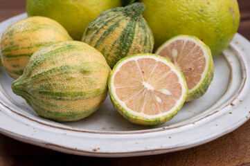 Fresh ripe bergamot citrus fruit and pink tiger lemons - obrazy, fototapety, plakaty