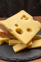 Swiss cheese collection, emmentaler with holes,  gruyere, appenzeller fondue cheeses