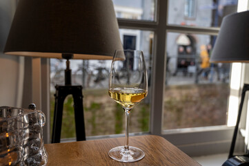 Glass of Chilean Chardonnay Viognier white wine served in cosy Dutch restaurant