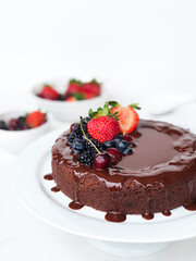 Chocolate cake with chocolate frosting and berries