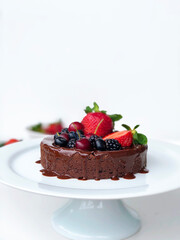 Mini chocolate cake with strawberries and berries