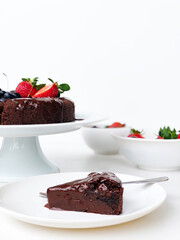 Slice chocolate cake with strawberries