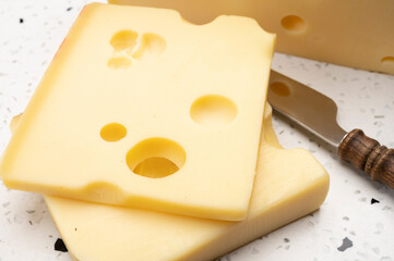 Swiss cheese collection, yellow emmentaler cheese with round holes