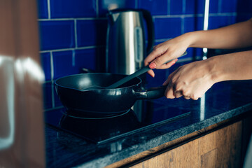 Closeup Young man cooking fresh food at home.