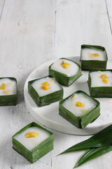 Kue tako or kuih tako nangka, Indonesian traditional sweet dessert topping with jackfruit slice.