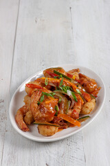 Udang saus asam manis or Sweet and sour prawns, made from fried prawns with tomato sauce.