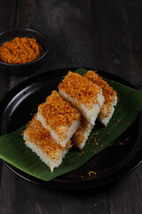 Ketan bumbu serundeng, traditional snack from Cirebon, Indonesia, made from sticky rice and topping with coconut dried powder.