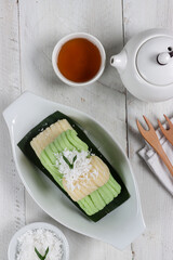 Getuk Lindri is a traditional Indonesian dessert made from mashed cassava, rolled into groovy loaf and topped with grated coconut.