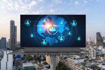 World planet Earth map hologram of social media icons over sunset panoramic cityscape of Bangkok, Southeast Asia. The concept of people connections.