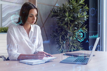 Attractive businesswoman in white shirt at workplace working with laptop to optimize development by...