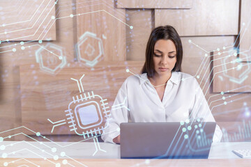 Attractive businesswoman in white shirt at workplace working with laptop to optimize development by...