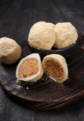 Mochi kacang or Injeolmi, Korean traditional rice cake made from the glutinous rice with peanuts filling and coated with soybean flour.