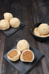 Mochi kacang or Injeolmi, Korean traditional rice cake made from the glutinous rice with peanuts filling and coated with soybean flour.