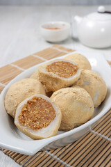 Mochi kacang or Injeolmi, Korean traditional rice cake made from the glutinous rice with peanuts filling and coated with soybean flour.