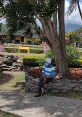 Obraz premium person sitting on a bench