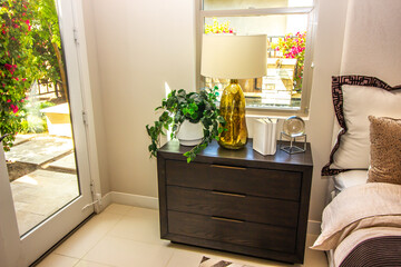 Master Bedroom Nightstand With Lamp, Plant And Decorator Items