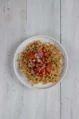 Mie goreng sambal matah or Instan fried noodle served with sambal matah.