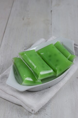 Kue Cantik Manis. Indonesian traditional steamed dessert made from mung bean flour, sago pearls and coconut milk.