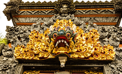 Demon head close up on one of temples in Ubud, Bali