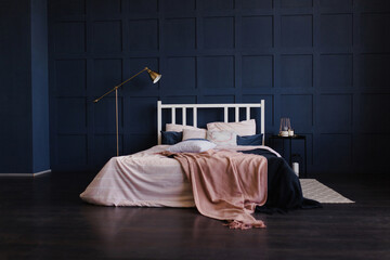 Pink bed on a blue wall. Modern classic