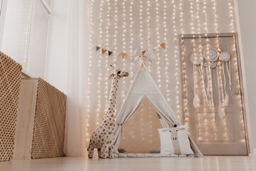 Children's toys with a wigwam. plush giraffe © Антон Романюк