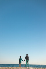 Fototapeta premium a boy and mother look at the sea