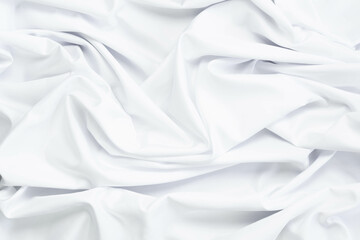 White fabric texture that is white cloth surface background with beautiful soft blur pattern.