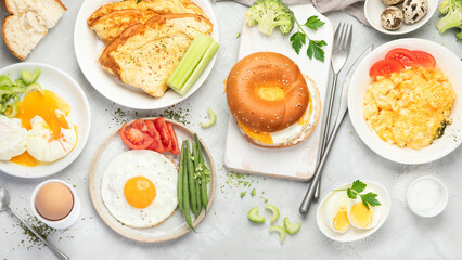 Various ways of cooking chicken eggs on light background.