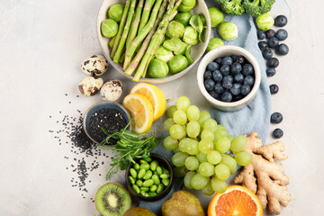 Raw and fresh vegetables and fruit on light background.