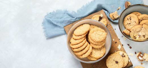Delicious oat cookies on light background.