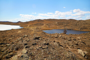 Rocky landscape of Olkhon Island in spring. Lake Baikal, Lake Heart.