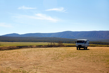 Naklejka premium A Russian SUV, a typical tourist bus on the island of Olkhon. A trip to Russia, Lake Baikal