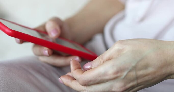 Person holds dice and smartphone in hands