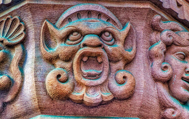 Bas relief decorative sculpture on facade of public building in downtown Frankfurt am Main, Germany.