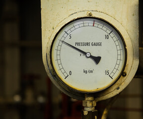 Industrial pressure gauge in the production close-up.