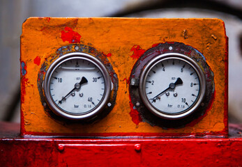 Industrial pressure gauge in the production close-up.