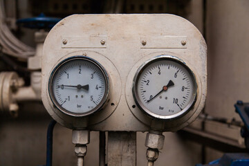 Industrial pressure gauge in the production close-up.